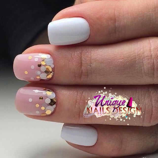 White nails with gold gem detail